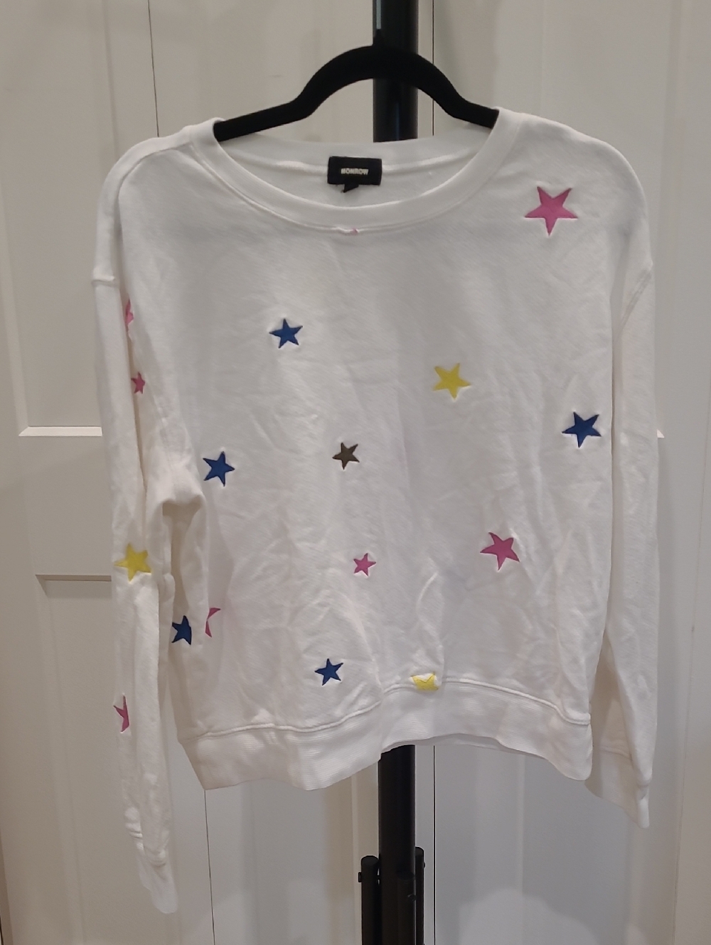 Monrow White Star Appliqué Sweatshirt with Pink, Blue & Yellow Stars